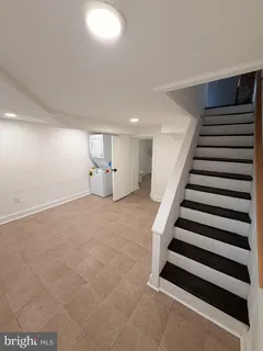 a view of an empty room with stairs