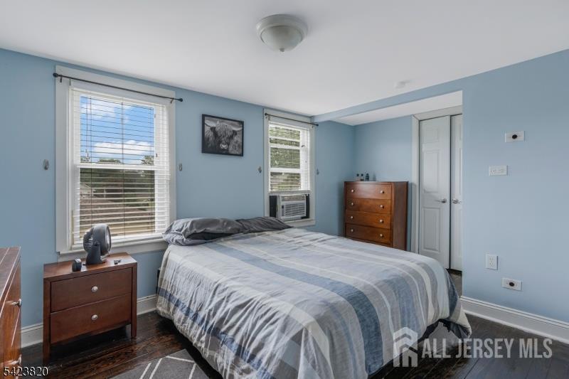 110 Parker Street Middlesex, NJ 08846 - Photo 17 of 25 a bedroom with a bed and wooden floor