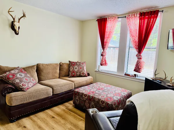 a living room with furniture and a window