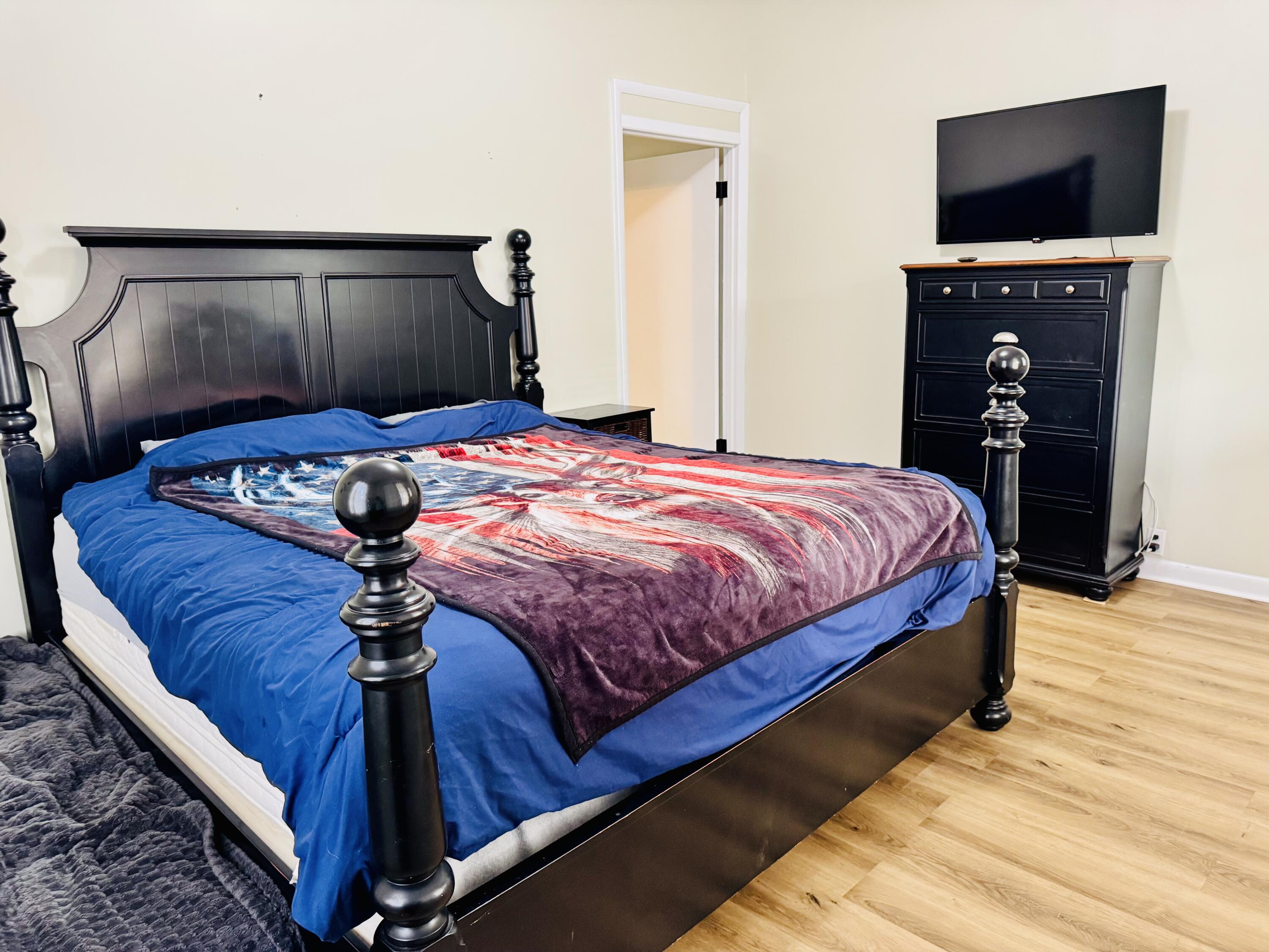 472 Claxton Avenue Elba, AL 36323 - Photo 28 of 29 a bedroom with a bed and a television