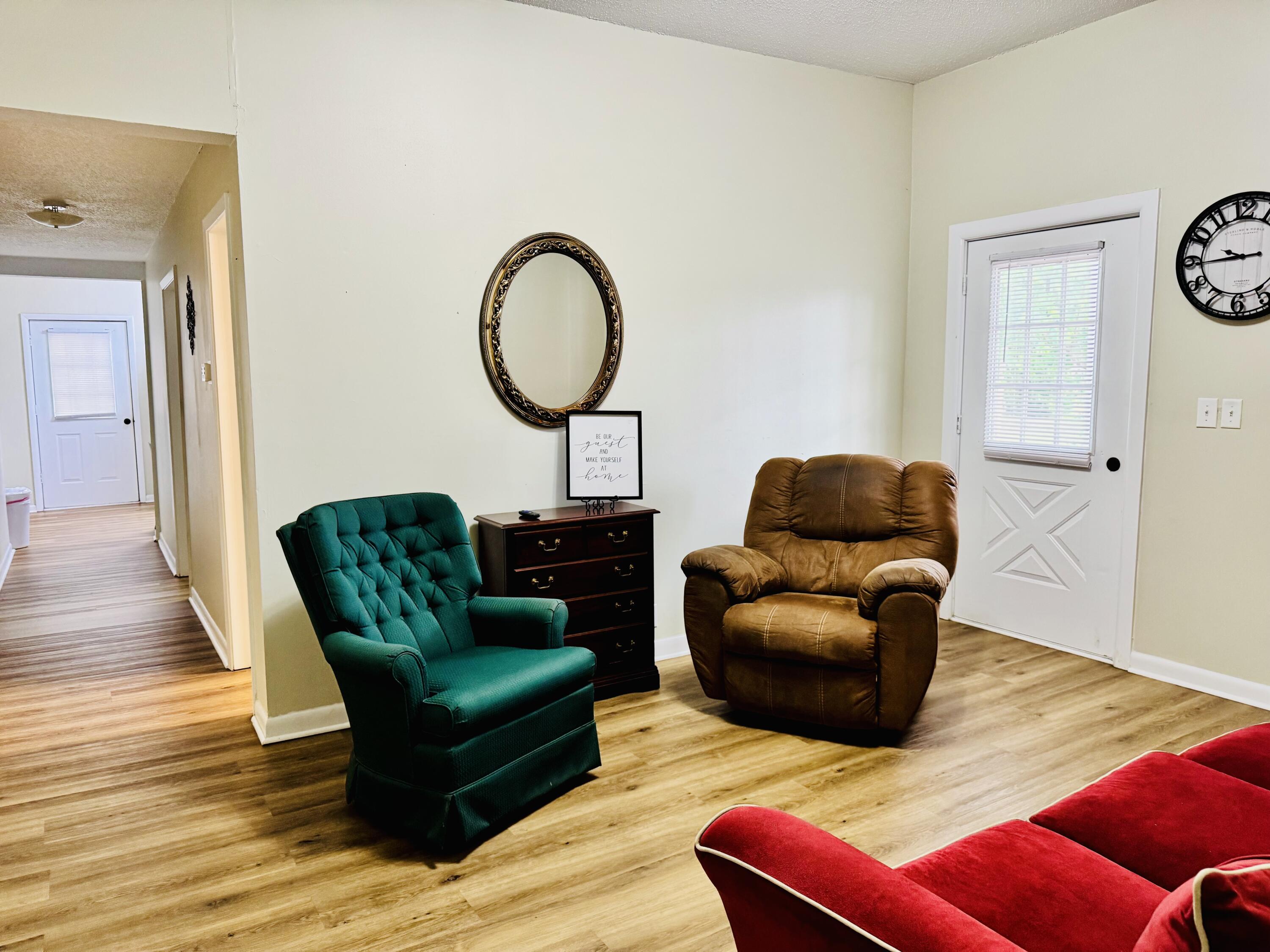 472 Claxton Avenue Elba, AL 36323 - Photo 6 of 29 a living room with furniture and a wooden floor