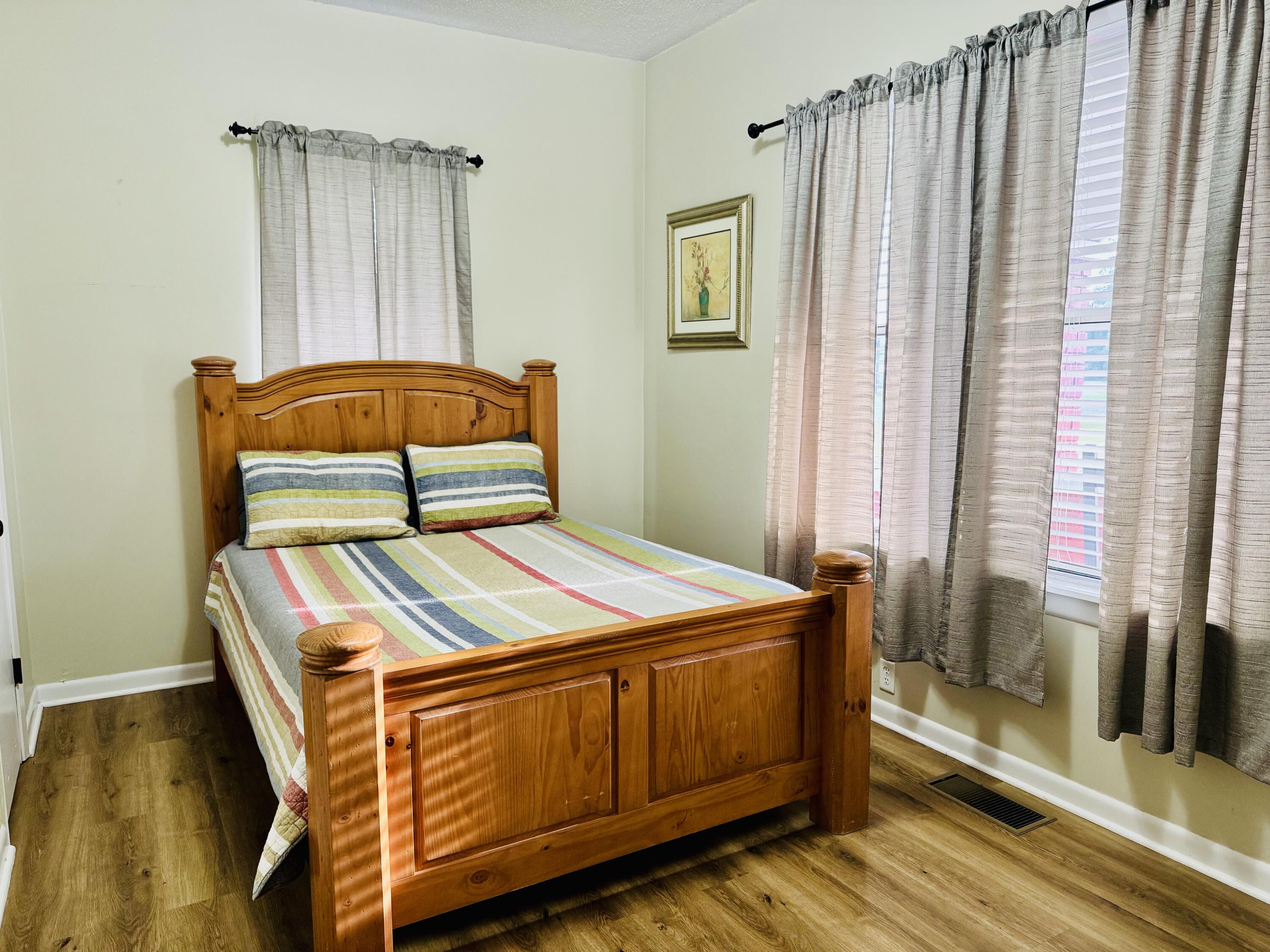472 Claxton Avenue Elba, AL 36323 - Photo 9 of 29 a bedroom with a bed and a window