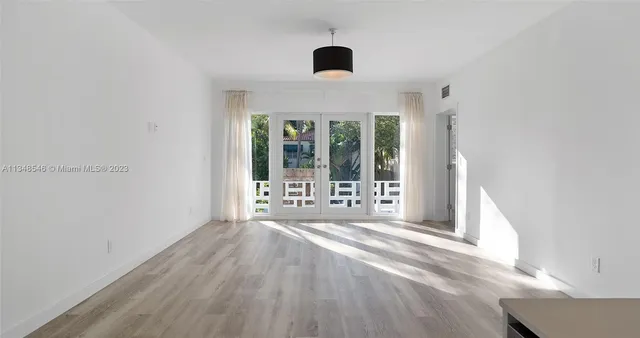 a white refrigerator freezer sitting inside of a kitchen