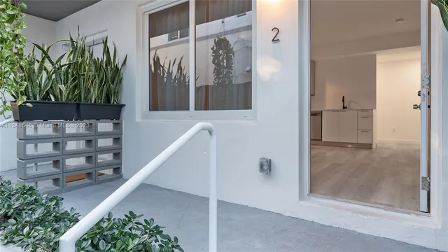 a front view of a building with a lot of windows