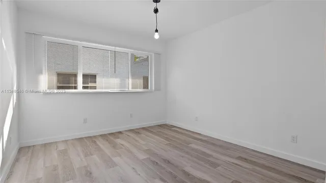 a kitchen with a stove and a microwave