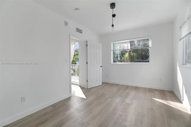 a view of a kitchen from the hallway