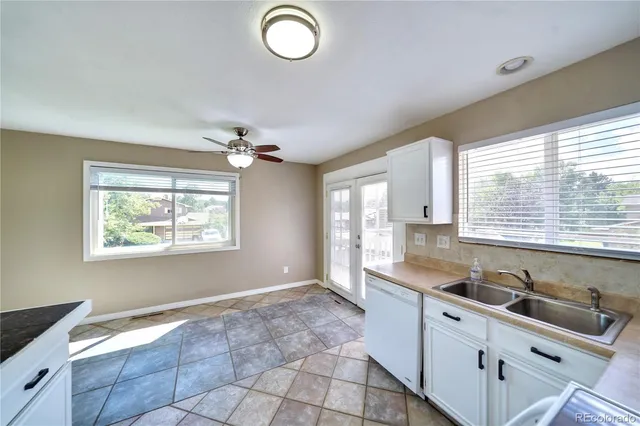 a kitchen with a sink and a window