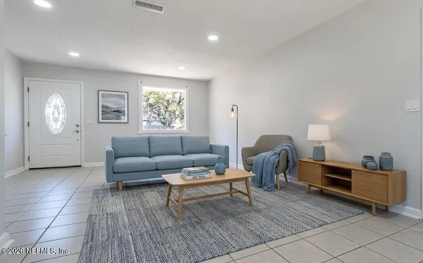 a living room with furniture and a window