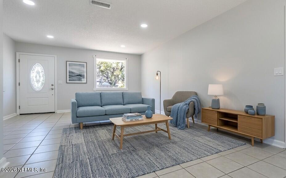 1283 Nantucket Avenue Atlantic Beach, FL 32233 - Photo 4 of 9 a living room with furniture and a window