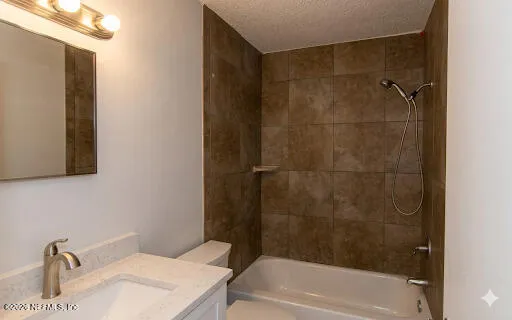 a bathroom with a sink a mirror and a bathtub