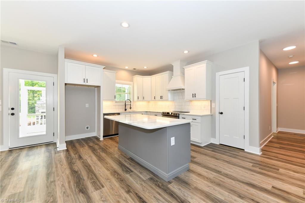 7900 Pate Drive Oak Ridge, NC 27310 - Photo 12 of 50 marble backsplash, quartz countertops, soft close custom cabinetry