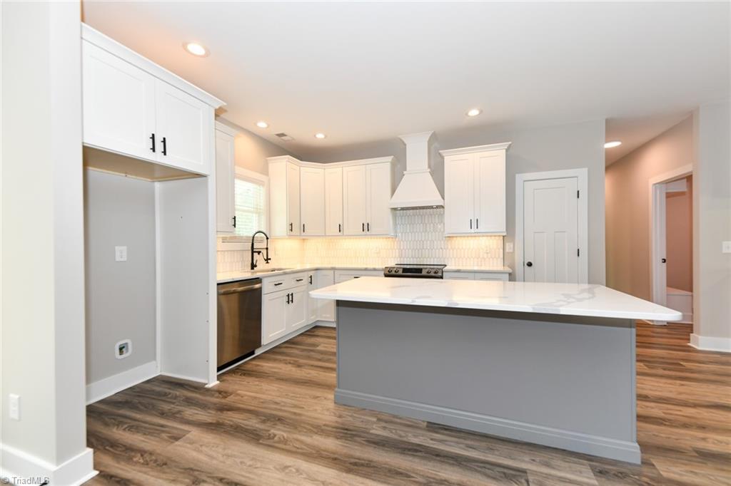 7900 Pate Drive Oak Ridge, NC 27310 - Photo 13 of 50 marble backsplash, quartz countertops, soft close custom cabinetry