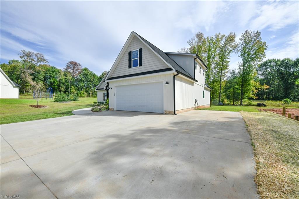 7900 Pate Drive Oak Ridge, NC 27310 - Photo 9 of 50 extended pavement driveway