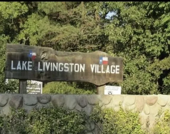 a street sign that is sitting in the middle of a park
