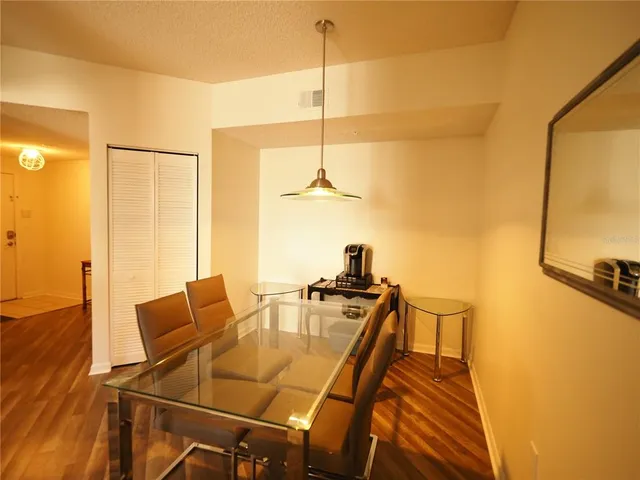 a dining room with table and chairs