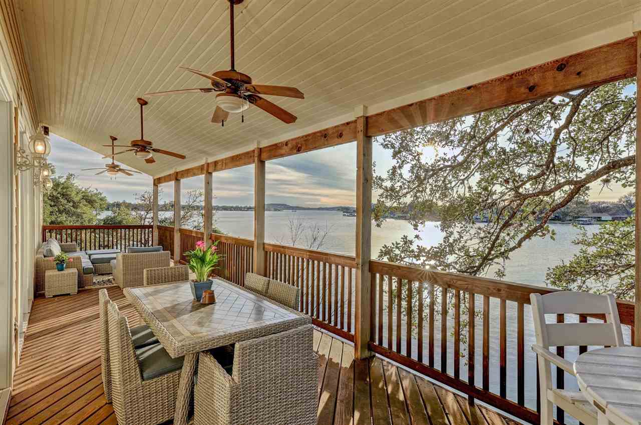 a view of a balcony dining area with furniture