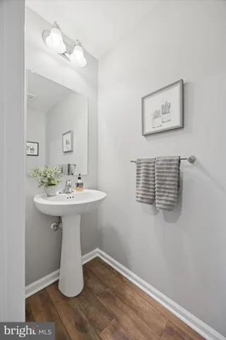 a white sink sitting next to a white cabinet