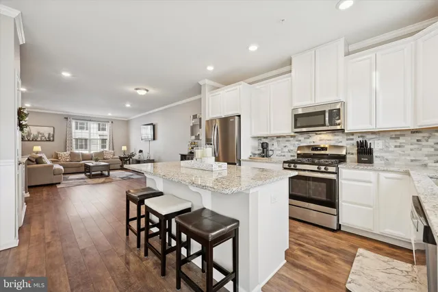 a kitchen with refrigerator and furniture