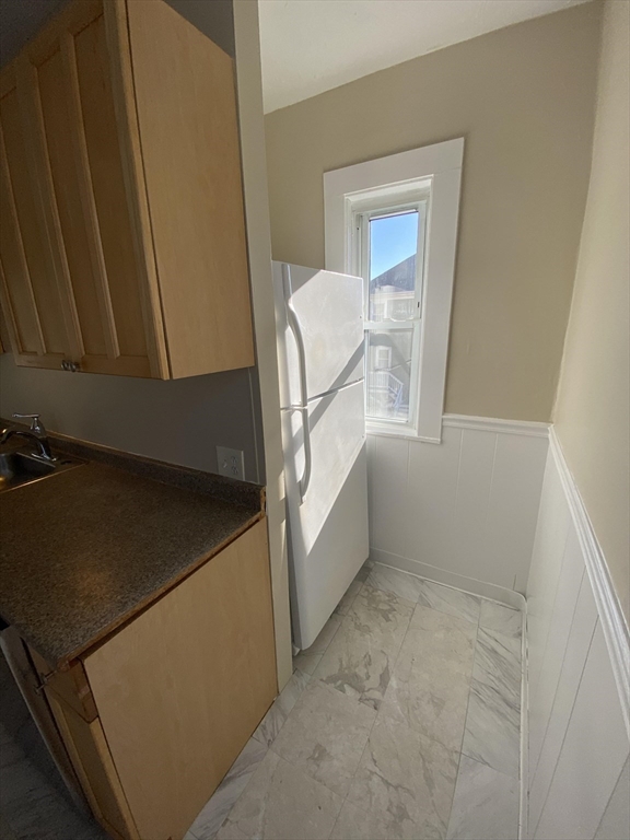 253 Whitwell Street, Unit 2R Quincy, MA 02169 - Photo 3 of 12 a view of an empty room with a window