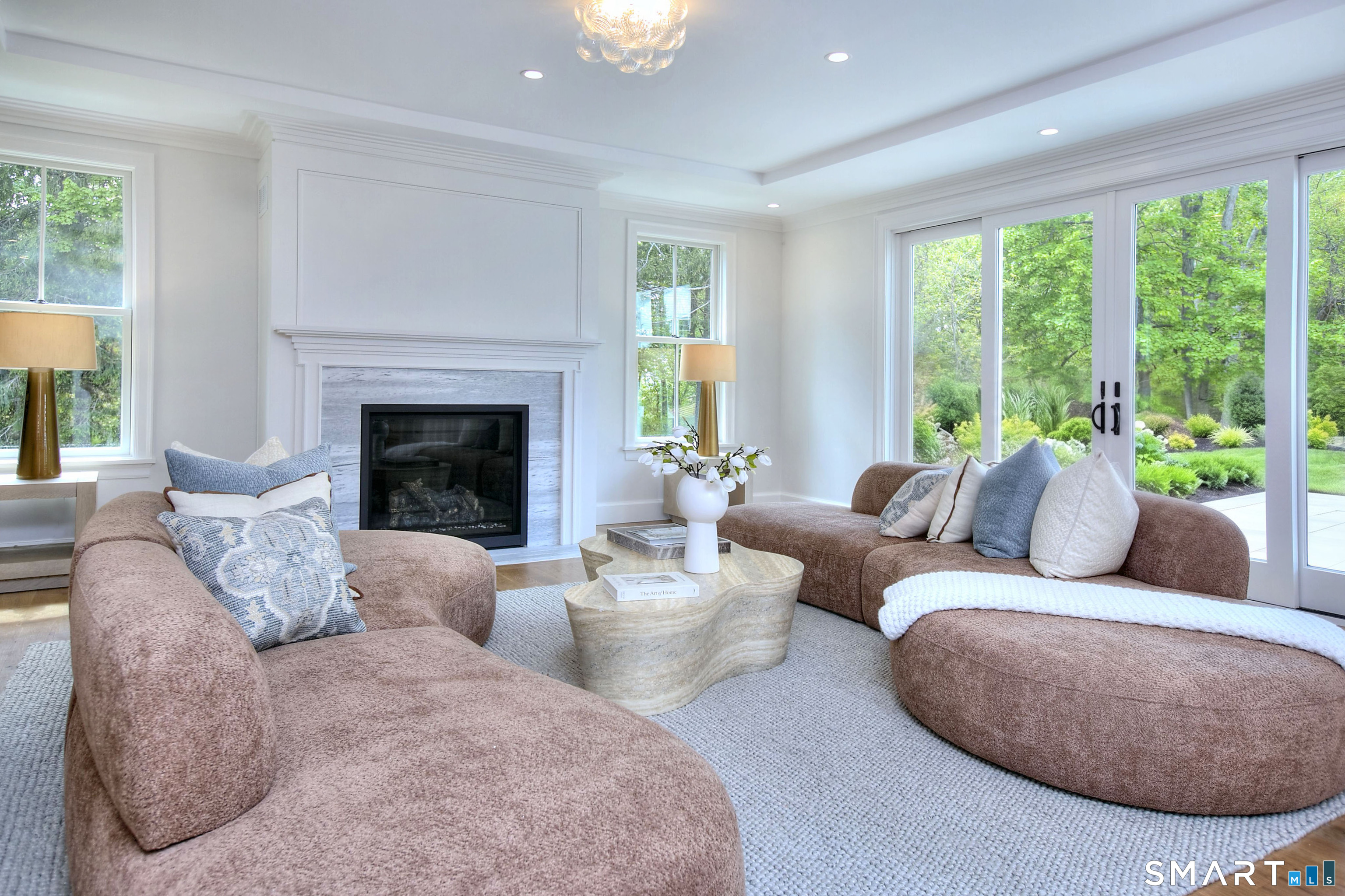 48 Kettle Creek Road Weston, CT 06883 - Photo 13 of 40 a living room with furniture and a fireplace