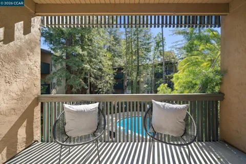 a view of balcony with furniture