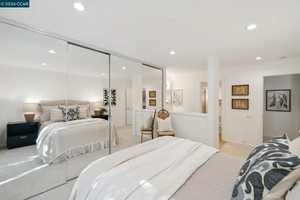 a bedroom with bed and a view of bedroom