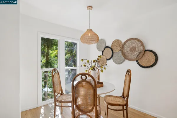 a view of a dining room with furniture window and flowerpot