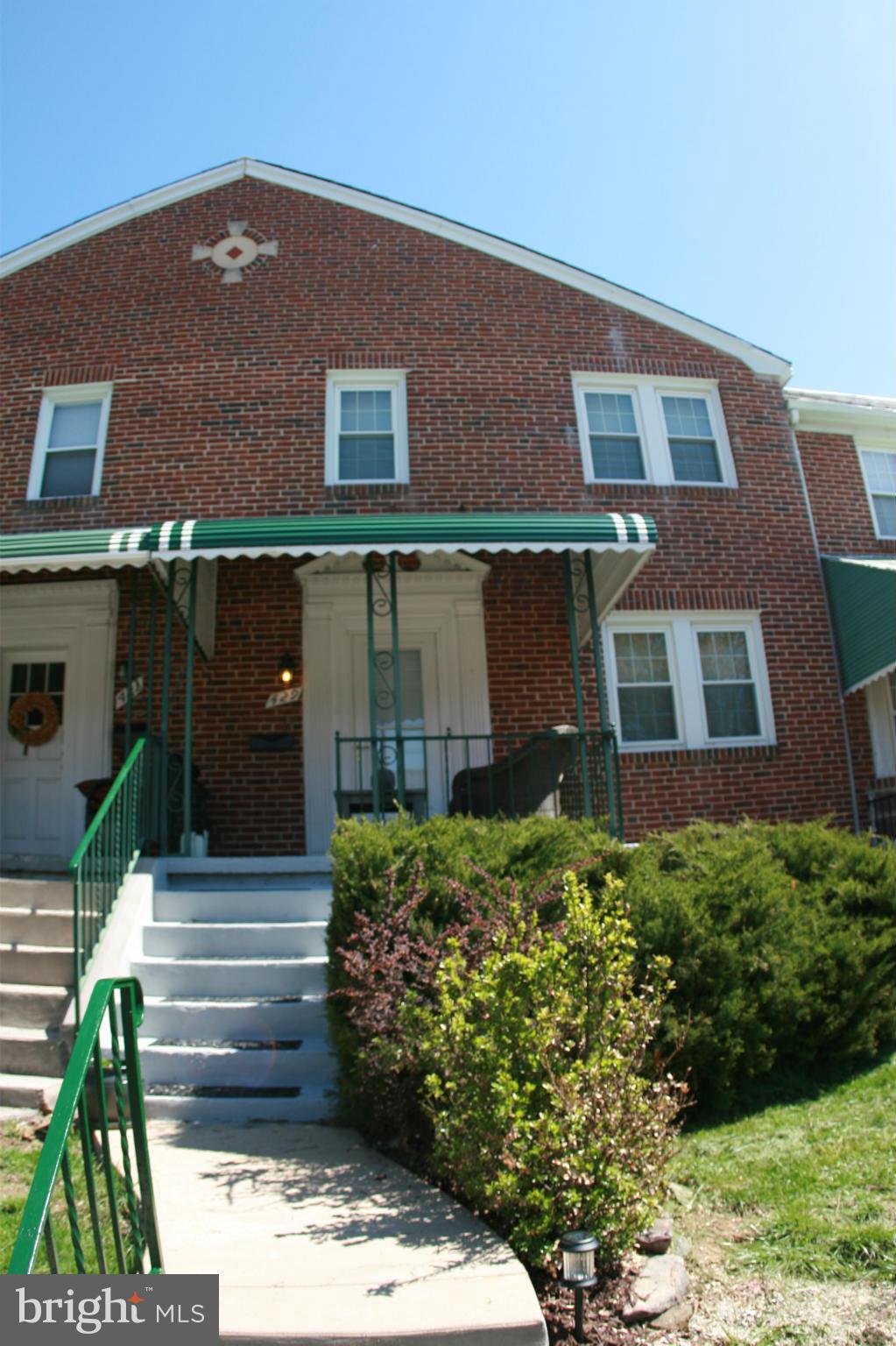 429 Academy Road Catonsville, MD 21228 - Photo 1 of 26 a building view with a garden space