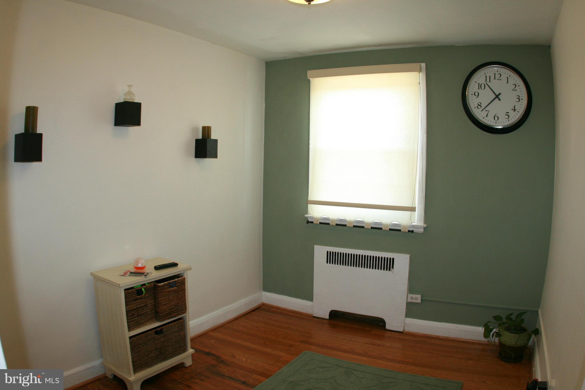 429 Academy Road Catonsville, MD 21228 - Photo 13 of 26 a view of a hallway with entryway wooden floor and front door