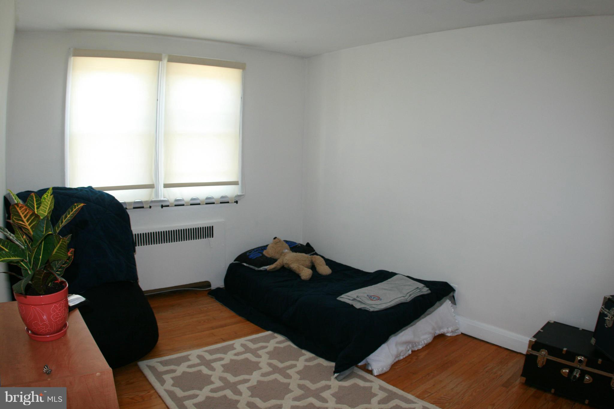 429 Academy Road Catonsville, MD 21228 - Photo 14 of 26 a bedroom with a bed and a window