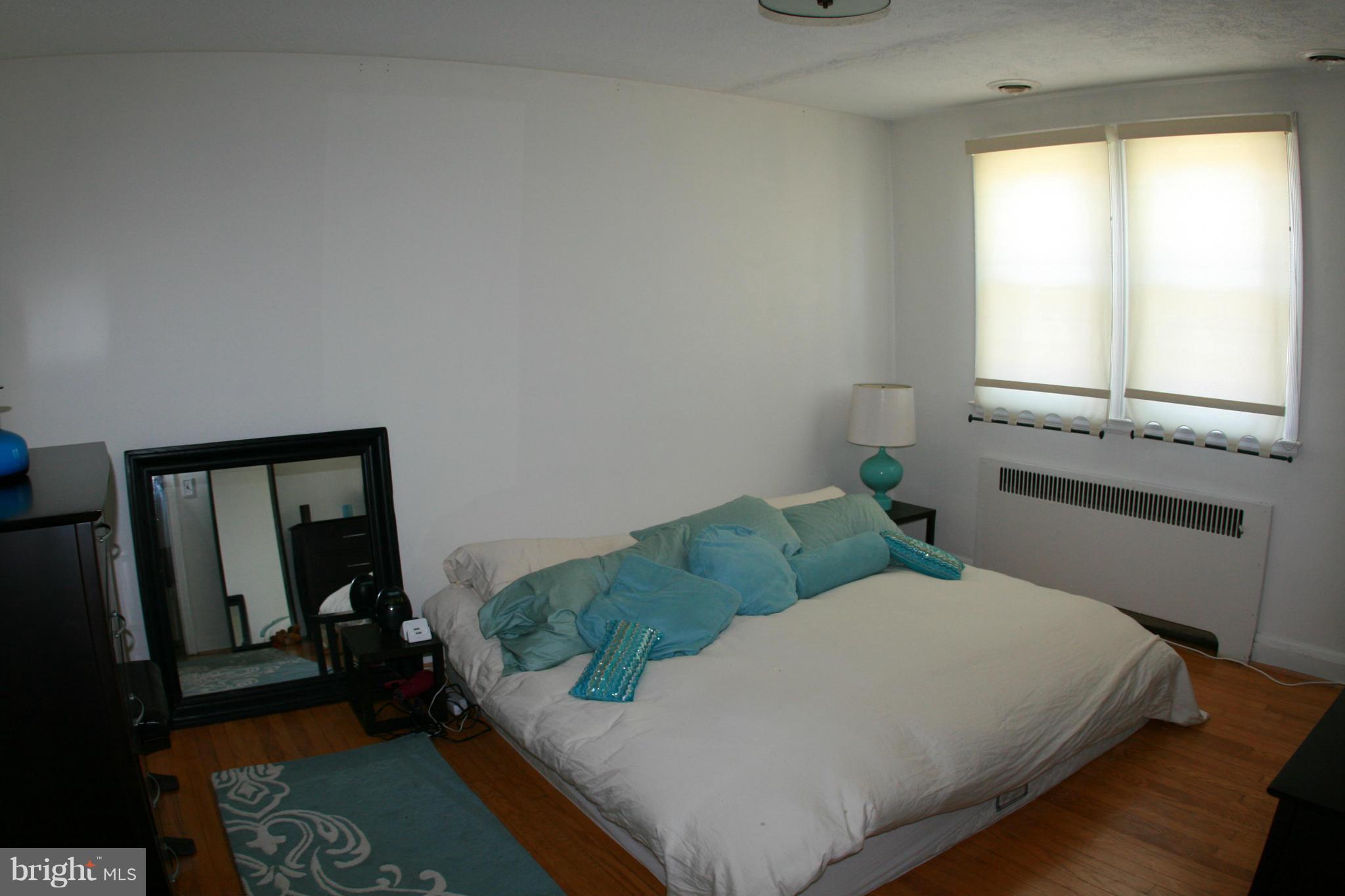 429 Academy Road Catonsville, MD 21228 - Photo 16 of 26 a bedroom with a bed and a window
