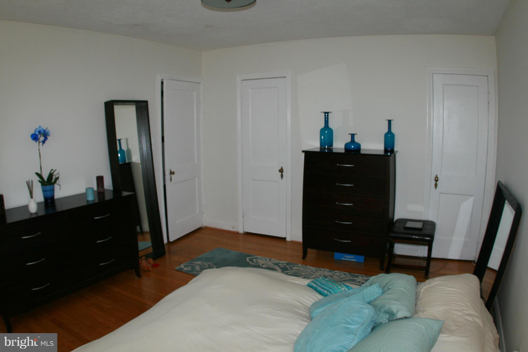 429 Academy Road Catonsville, MD 21228 - Photo 17 of 26 a bedroom with a bed and a dresser