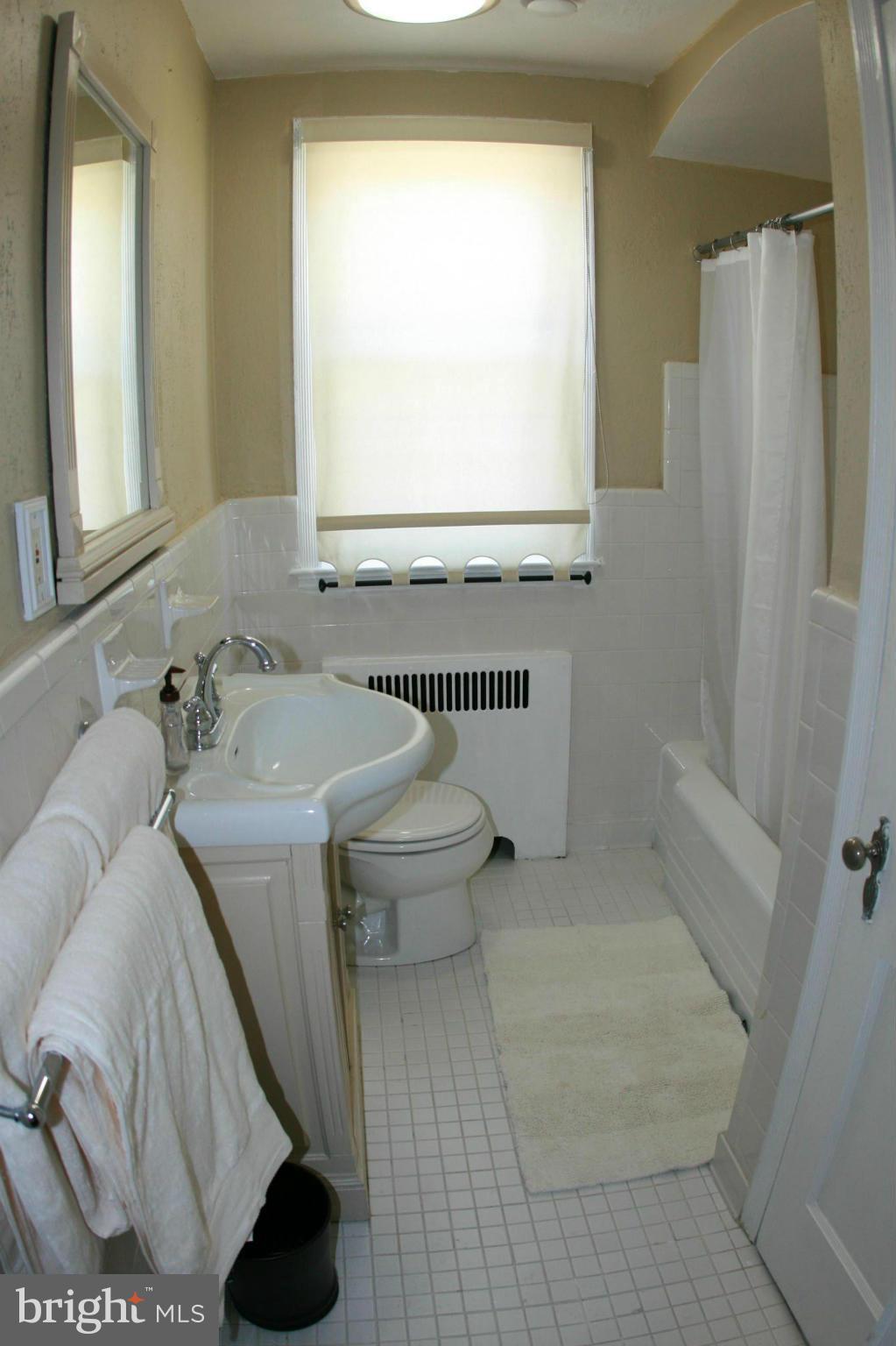 429 Academy Road Catonsville, MD 21228 - Photo 18 of 26 a bathroom with a sink toilet and shower
