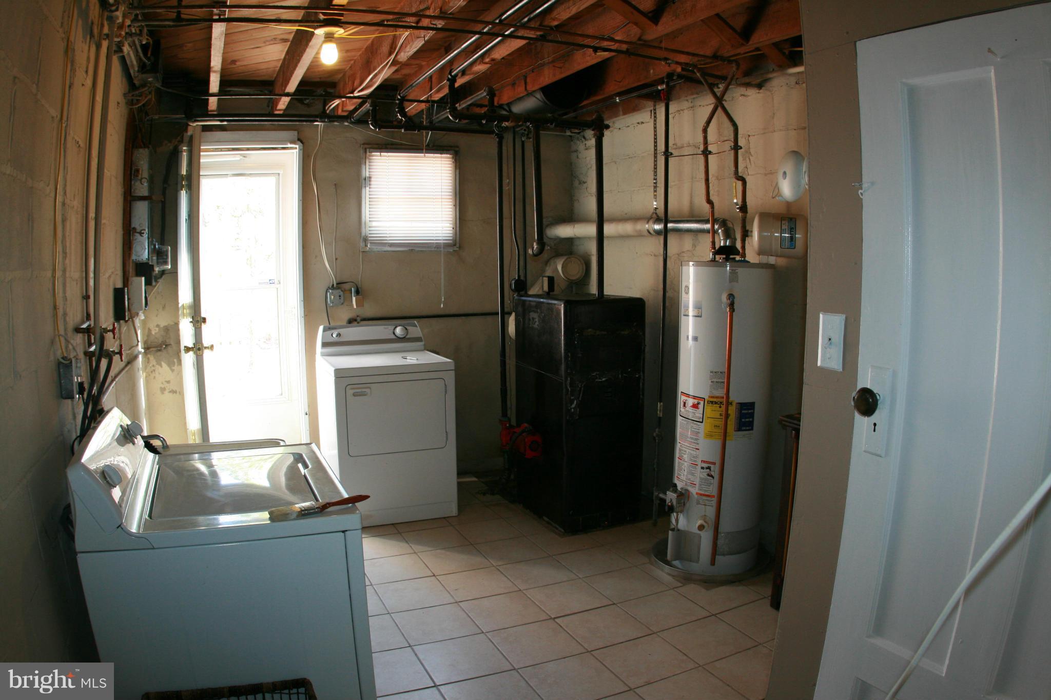 429 Academy Road Catonsville, MD 21228 - Photo 24 of 26 a room with refrigerator and washer