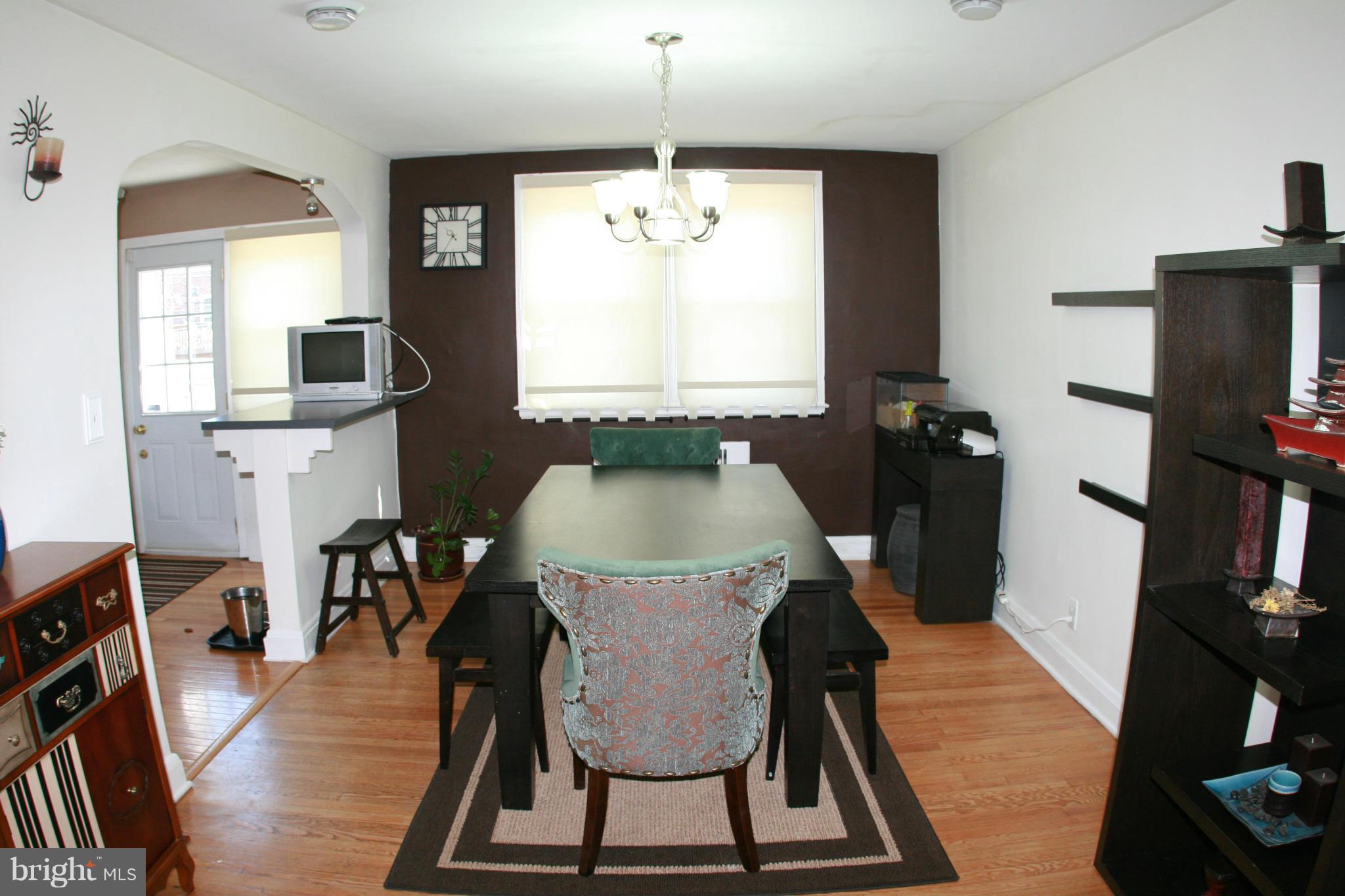 429 Academy Road Catonsville, MD 21228 - Photo 5 of 26 a view of a dining room with furniture window and wooden floor