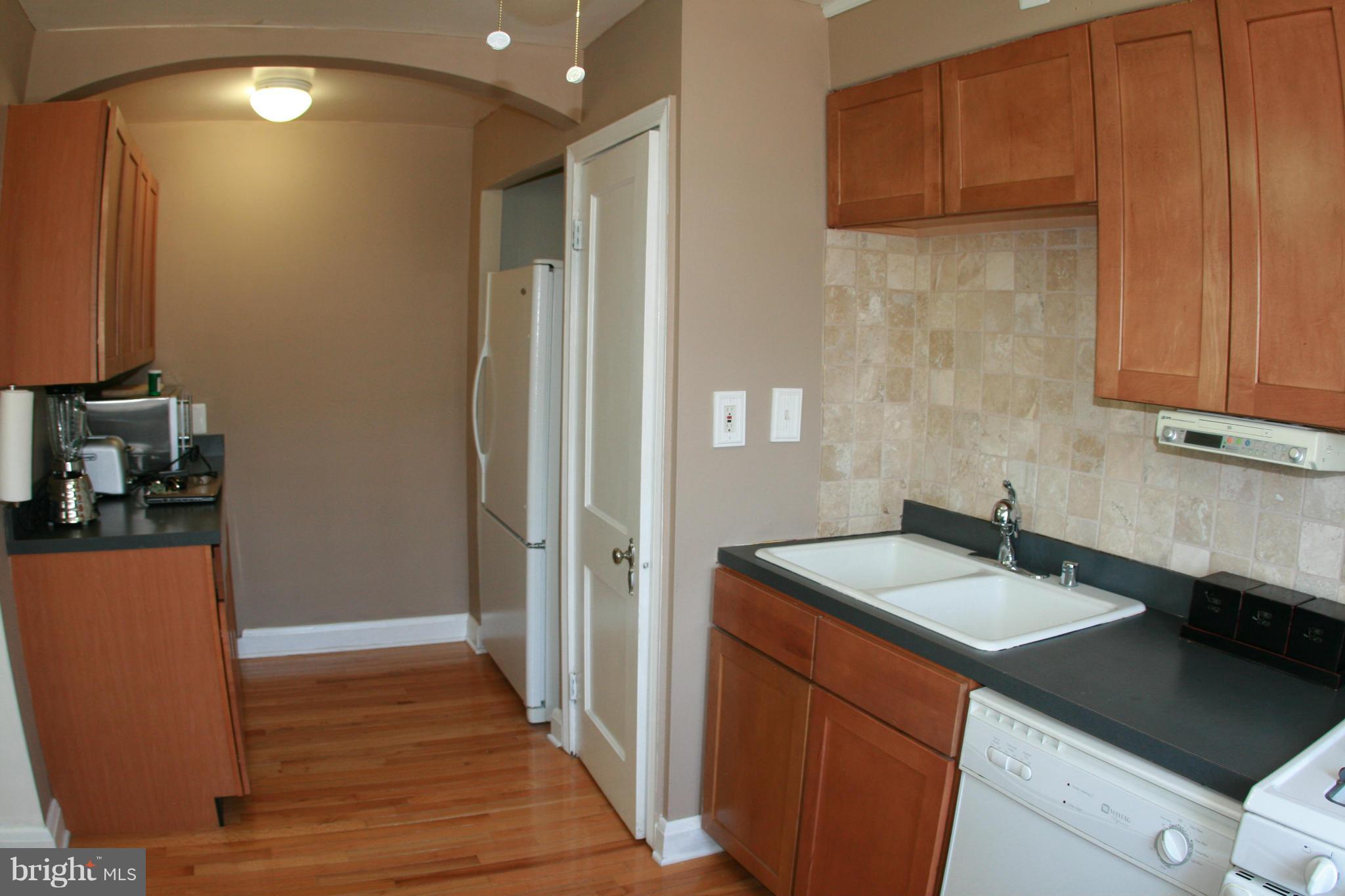 429 Academy Road Catonsville, MD 21228 - Photo 9 of 26 a kitchen with sink and cabinets