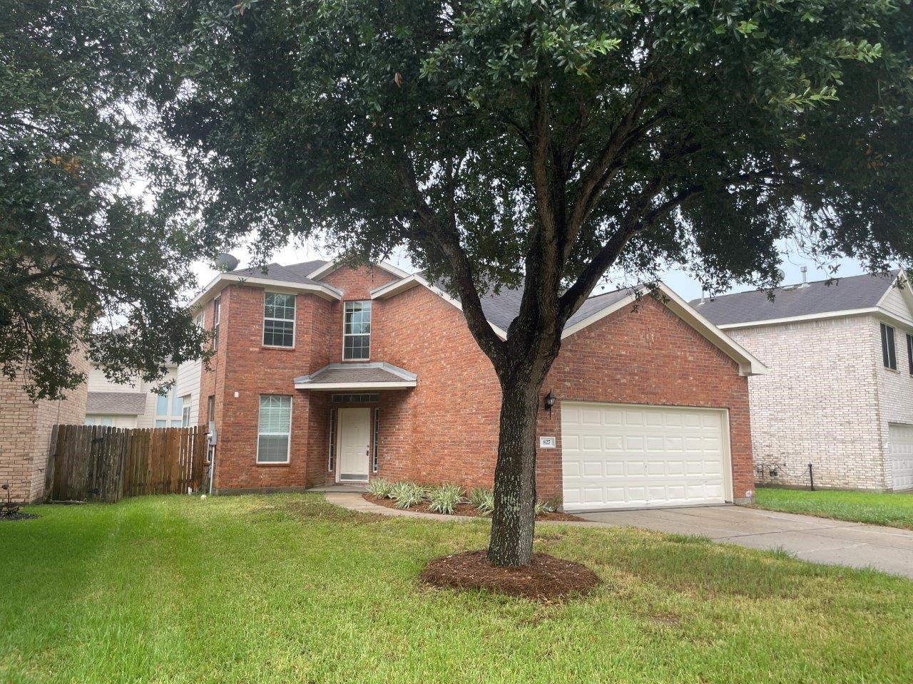 827 Chase View Drive Bacliff, TX 77518 - Photo 1 of 30 a front view of a house with a garden and yard