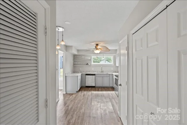 a room with a wooden floor and white walls