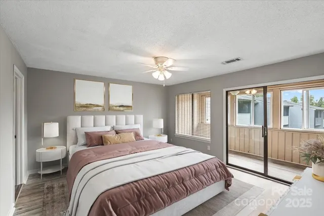 a bedroom with a large bed and a window