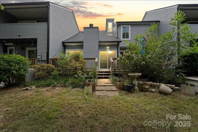 a view of a patio with couches and potted plants