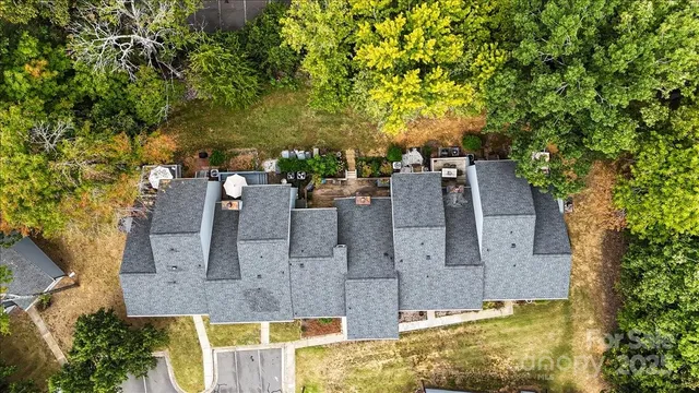 an aerial view of residential houses with outdoor space