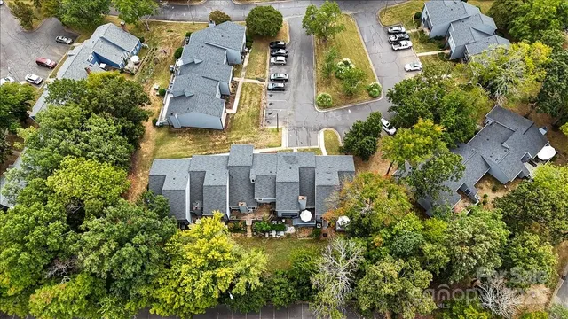 an aerial view of multiple houses with yard