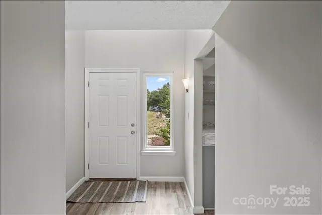 a view of an empty room with windows