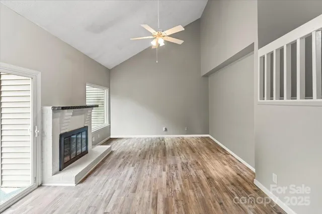 wooden floor in an empty room with a fireplace