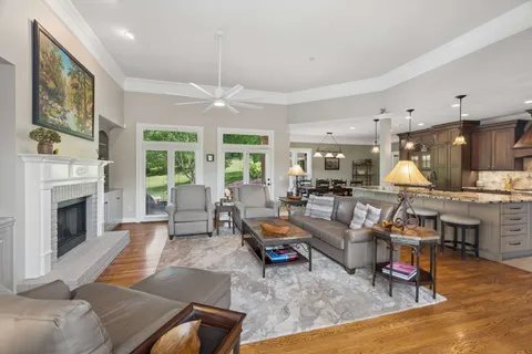 a large kitchen with a table and chairs