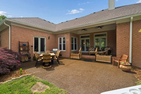 a view of a house with a backyard