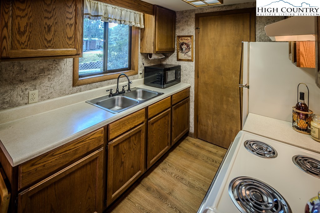 35 Maple Drive, Unit B Banner Elk, NC 28604 - Photo 12 of 21 a kitchen with a sink a stove and cabinets