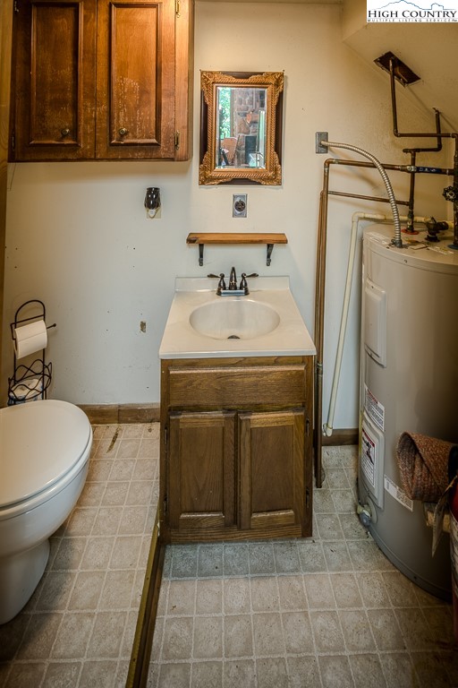 35 Maple Drive, Unit B Banner Elk, NC 28604 - Photo 13 of 21 a utility room with a sink a washer and dryer