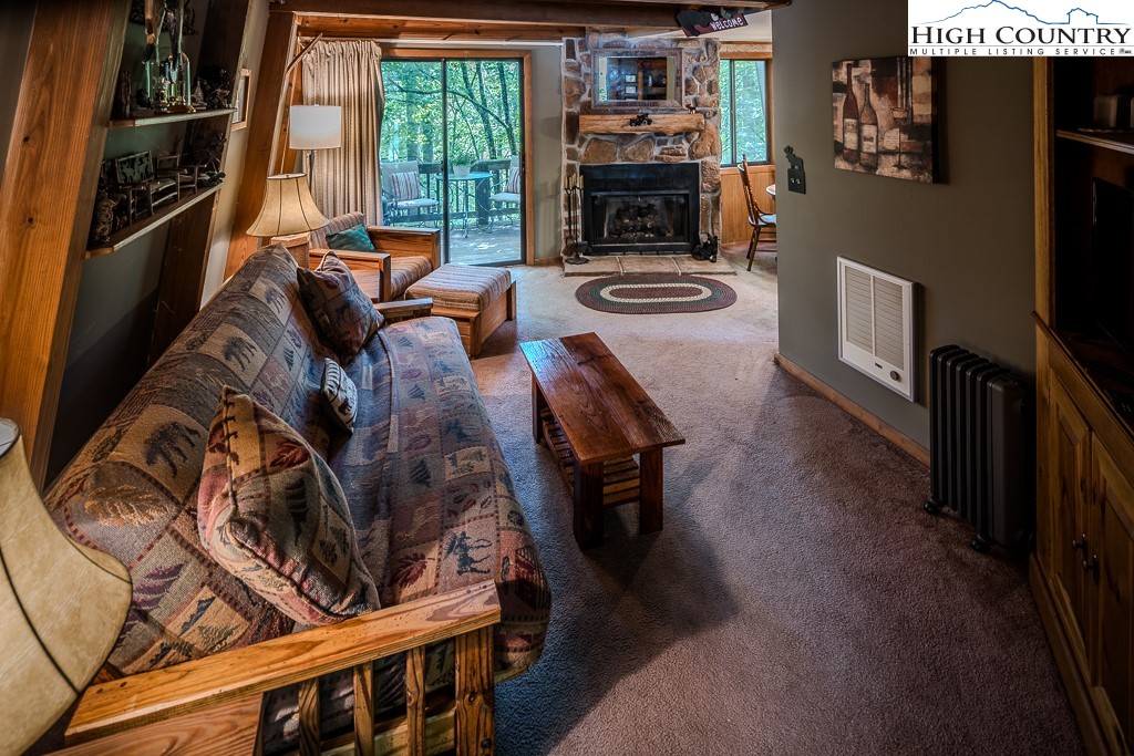 35 Maple Drive, Unit B Banner Elk, NC 28604 - Photo 2 of 21 a living room with furniture and a fireplace