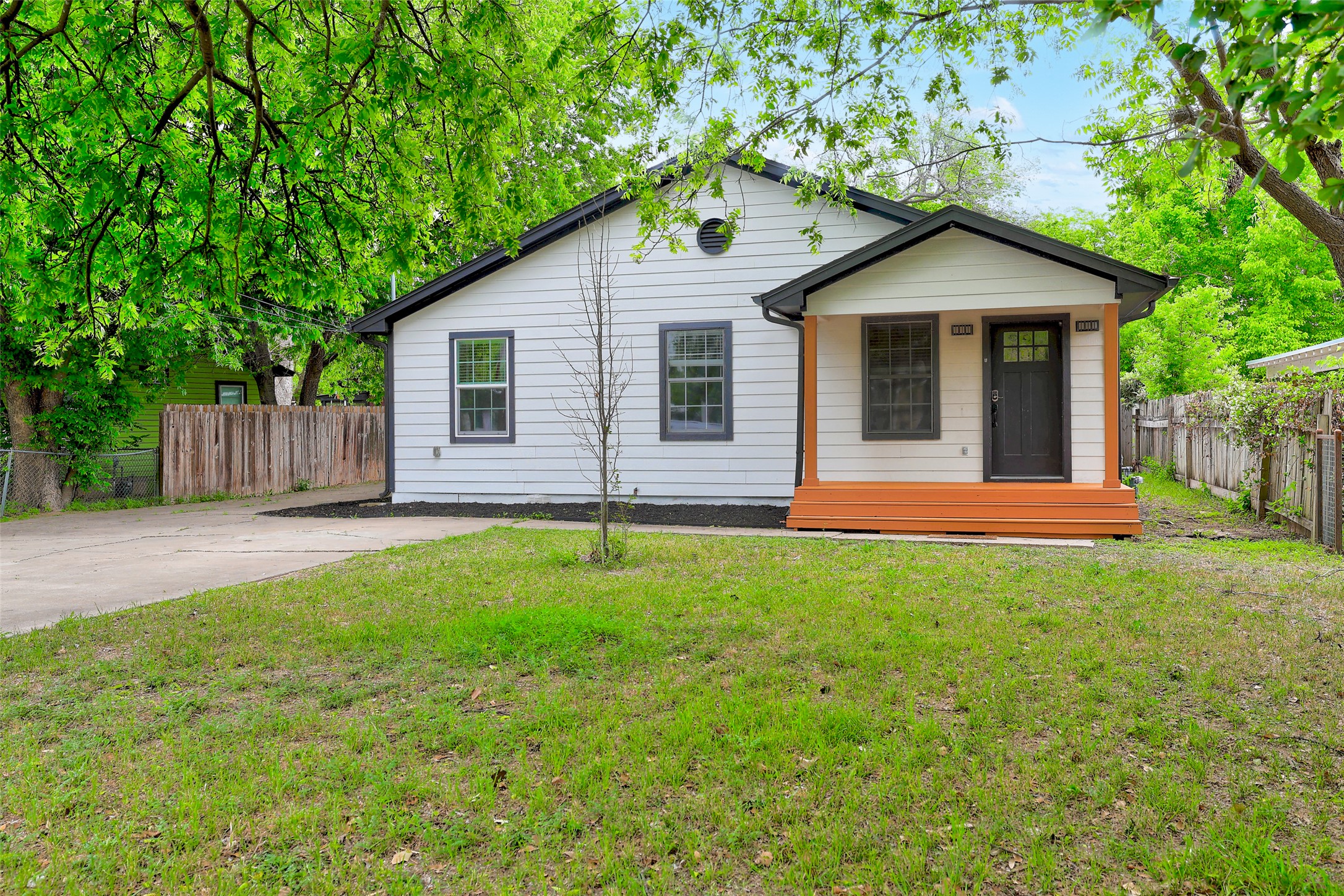 6307 Chesterfield Avenue Austin, TX 78752 - Photo 1 of 20 a front view of a house with yard and green space